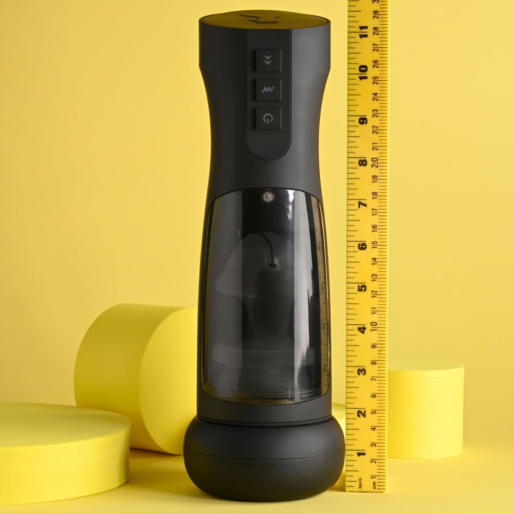 Front view of the Playboy Pleasure End Game vibrating stroker with a ruler beside it for size reference on a yellow background | Flirty Bay adult store Perth